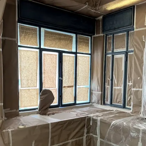 Window wall masked and ready for painting